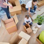 bigstock Family unpacks moving boxes wh 303879574