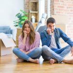 bigstock Young beautiful couple moving 307245415